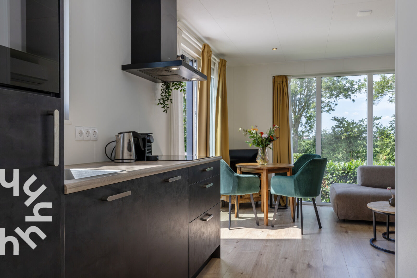 Kitchen with dark cabinets and a wooden worktop