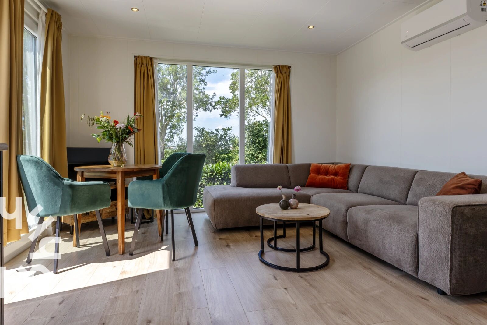 Living room with corner sofa and dining area